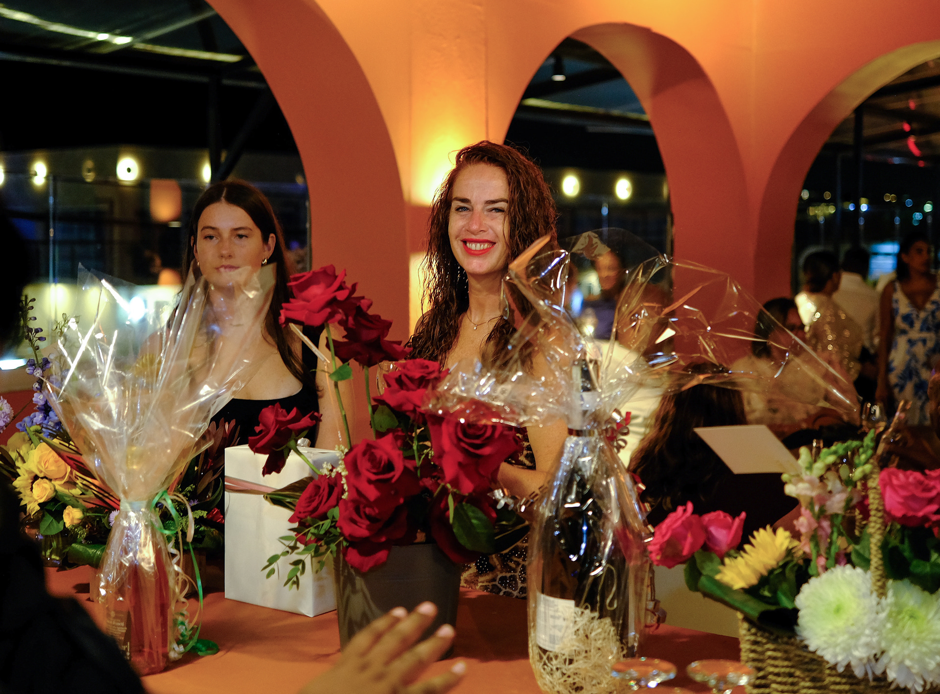 Guests celebrating a special occasion with flowers